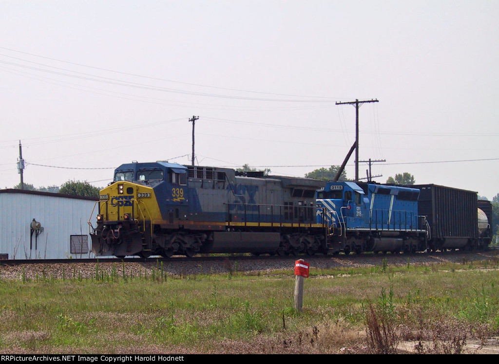 CSX 339 leads a train towards the yard